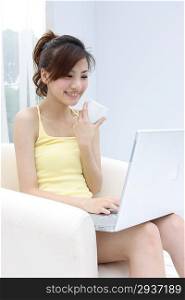 Girl sitting surfing on Internet