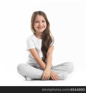 Girl sitting turkish. Portrait of small girl sitting turkish isolated on white background