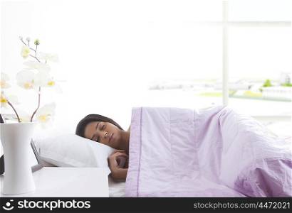 Girl sleeping on bed
