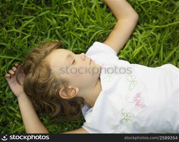 Girl sleeping on the grass