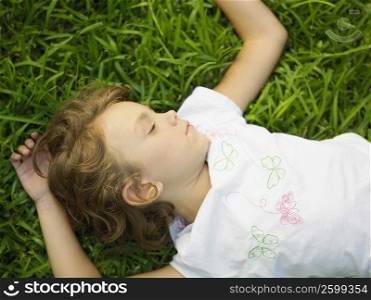 Girl sleeping on the grass