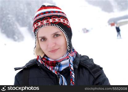 girl smiling and snow is falling