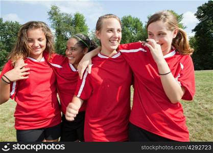 Girl soccer players laughing