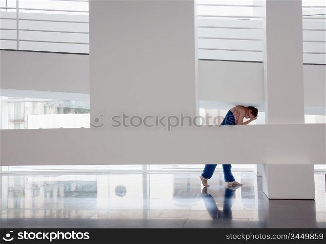 girl squeezed in modern architecture photo