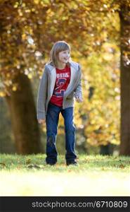 Girl standing in a park and smiling