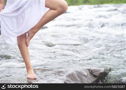 Girl standing in the stream