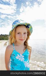 Girl standing on beach portrait