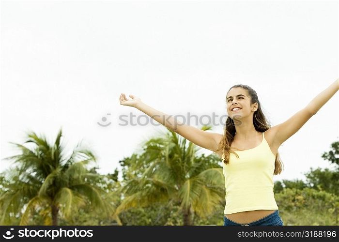 Girl standing with her arms outstretched