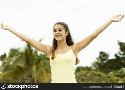 Girl standing with her arms outstretched