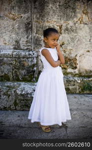 Girl standing with her hand on her chin, Santo Domingo, Dominican Republic