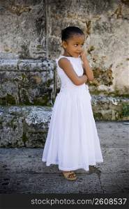 Girl standing with her hand on her chin, Santo Domingo, Dominican Republic