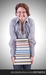 Girl student with books on white