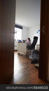 Girl Studying In Bedroom Using Laptop