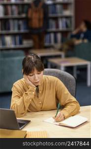 girl studying university library