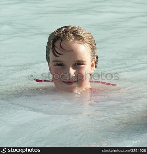 Girl swimming in mineral pool