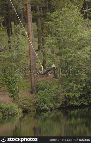 Girl swinging on a rope
