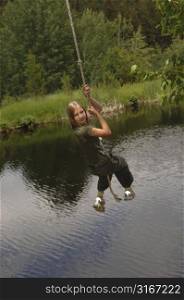 Girl swinging on a rope