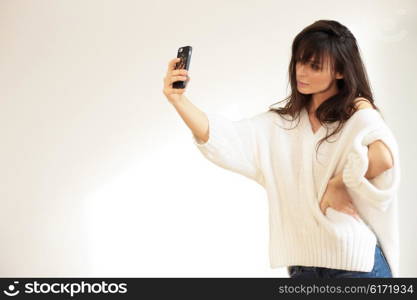 Girl taking selfie. Natural light.