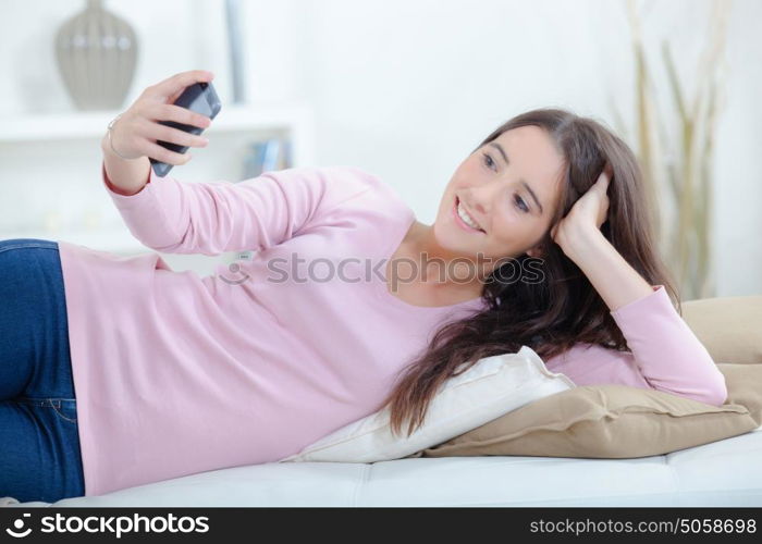 Girl taking selfie with cellphone