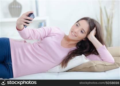 Girl taking selfie with cellphone