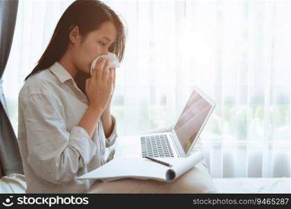 Girl teen wiping nose while online homeschooling with flu illness Coronavirus Covid-19  infected, stay home working with laptop computer self care during lockdown the city.