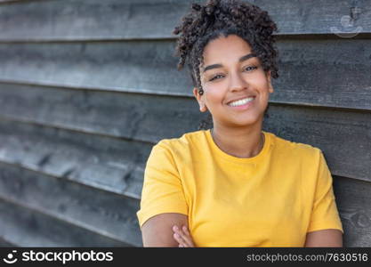 Girl teenager teen female young African American mixed race biracial woman outside smiling with perfect teeth