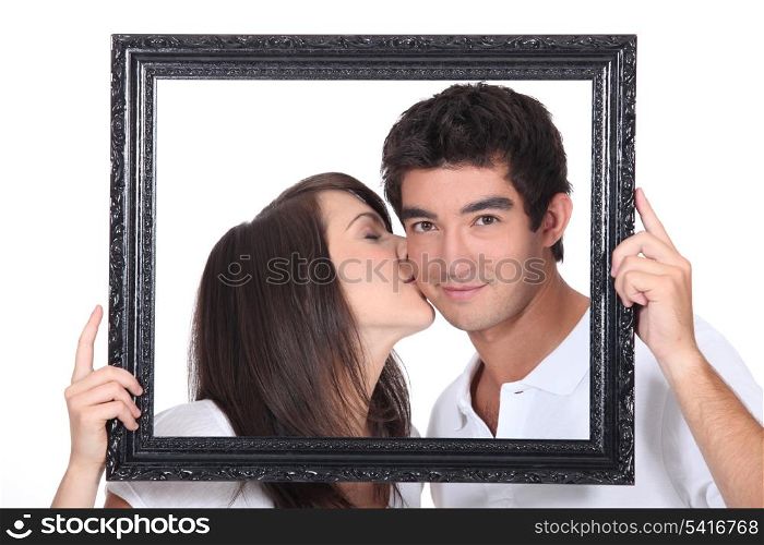Girl tenderly kissing a man