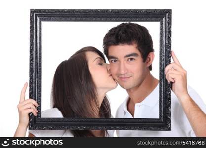 Girl tenderly kissing a man
