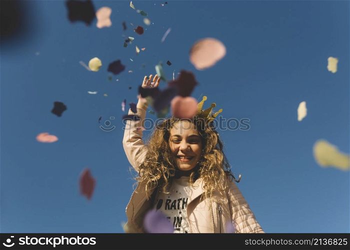 girl throwing confetti