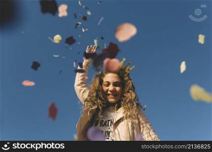 girl throwing confetti