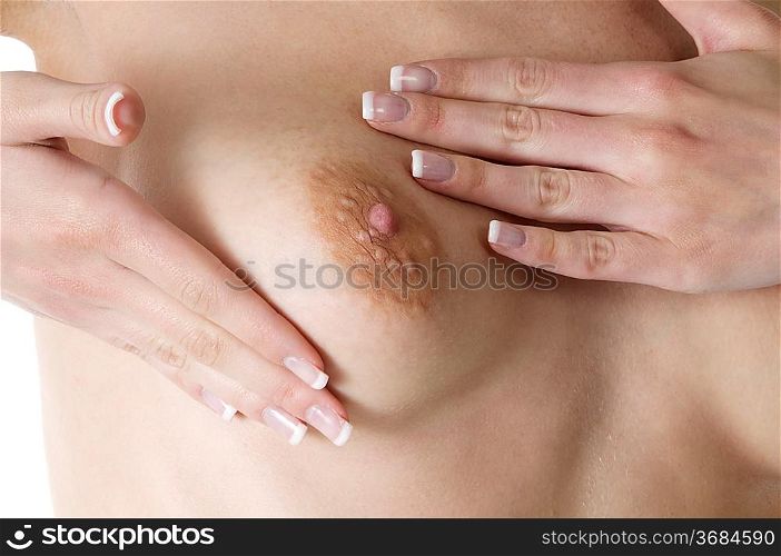 girl touching her breast to check it for her health care