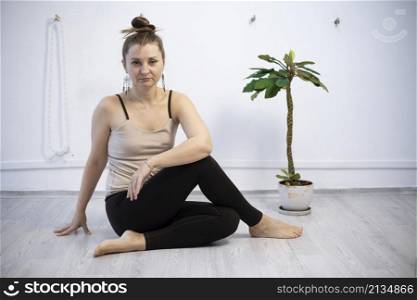 girl training in yoga studio. Healthy and fly Yoga Concept. happy smiling girl