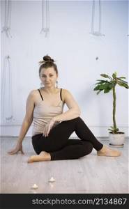 girl training in yoga studio. Healthy and fly Yoga Concept. happy smiling girl
