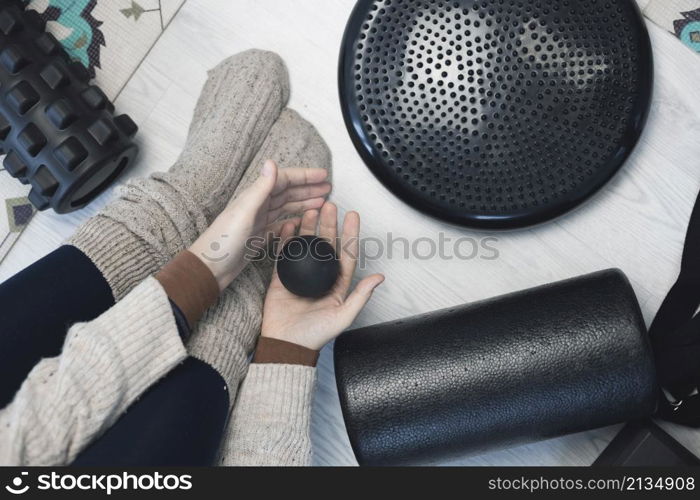 girl training in yoga studio. Healthy and Yoga Concept. girl is engaged on a yoga roller