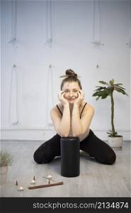 girl training in yoga studio. Healthy and Yoga Concept. happy smiling girl