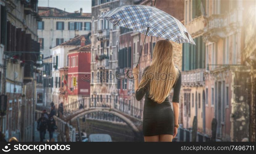 Girl under an umbrella in Venice. Italy