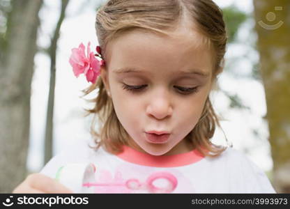 Girl using a bubble wand