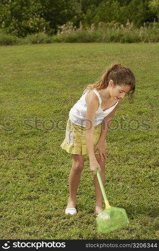 Girl using a butterfly net