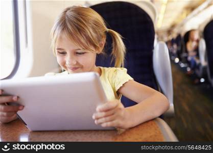 Girl Using Digital Tablet On Train