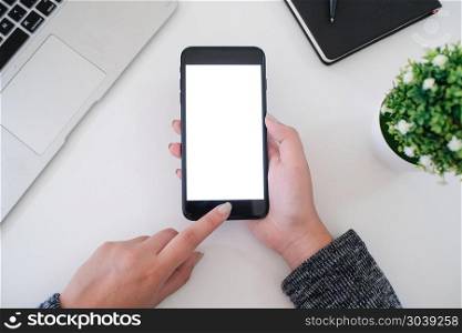 girl using smart phone in office. hand holding smart phone white screen.. girl using smart phone in office. hand holding smart phone white