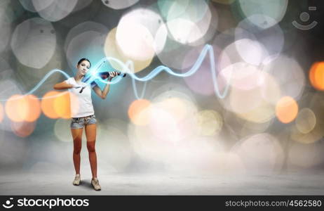 Girl violinist. Young girl in shorts and shirt playing violin