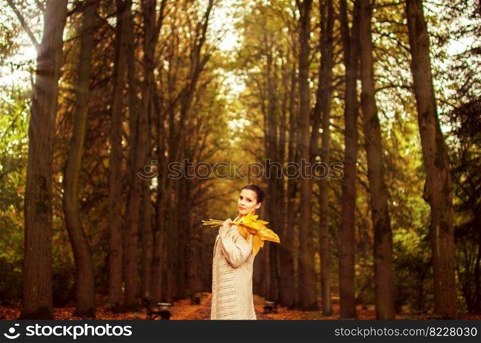 girl walking in the park in autumn