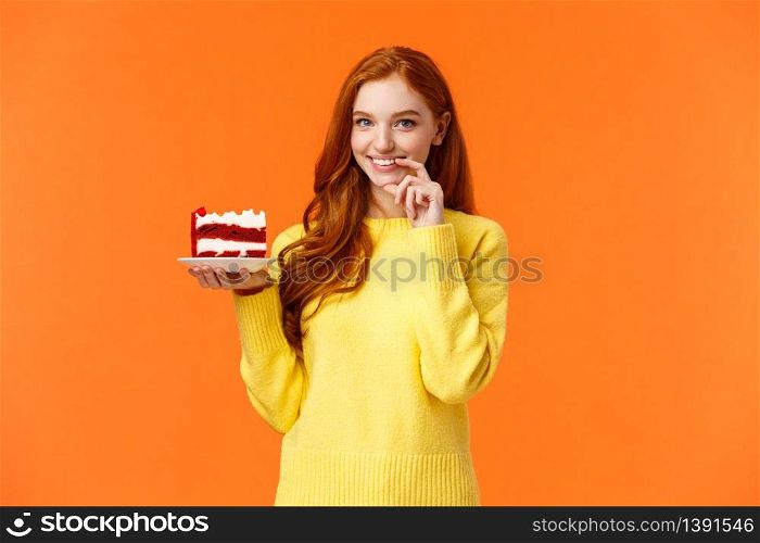 Girl wants share her piece cake with loved one. Romantic silly cute girlfriend brink piece dessert to eat together, smiling and touching lip flirty, eating junk food during diet, orange background.. Girl wants share her piece cake with loved one. Romantic silly cute girlfriend brink piece dessert to eat together, smiling and touching lip flirty, eating junk food during diet, orange background
