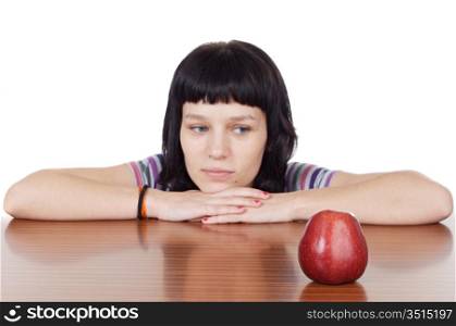 girl watching a red apple to over white background (focus in the apple)