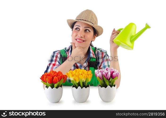 Girl watering plants on white