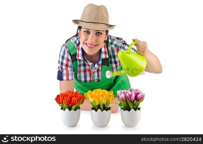 Girl watering plants on white