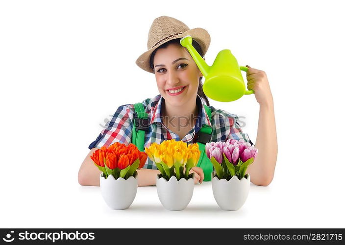 Girl watering plants on white