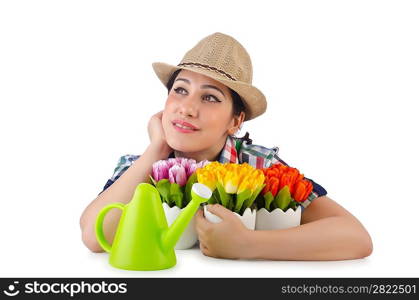 Girl watering plants on white