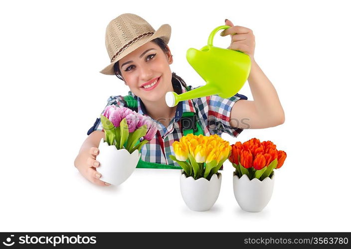 Girl watering plants on white