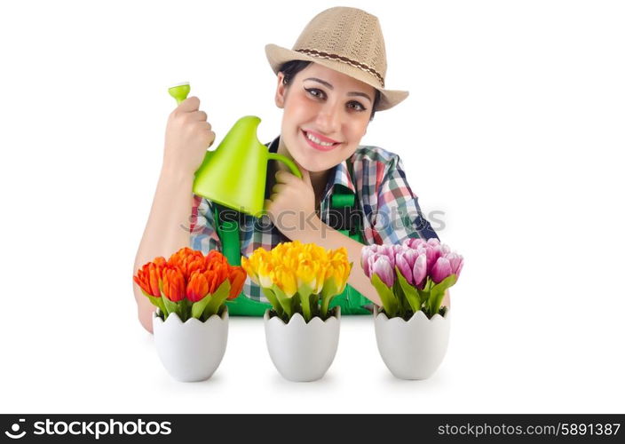 Girl watering plants on white